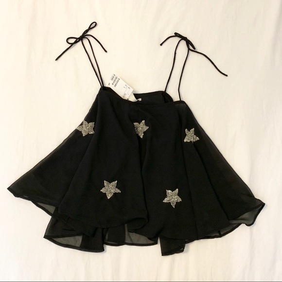 H&M Tops - H&M flowy star tank sz L